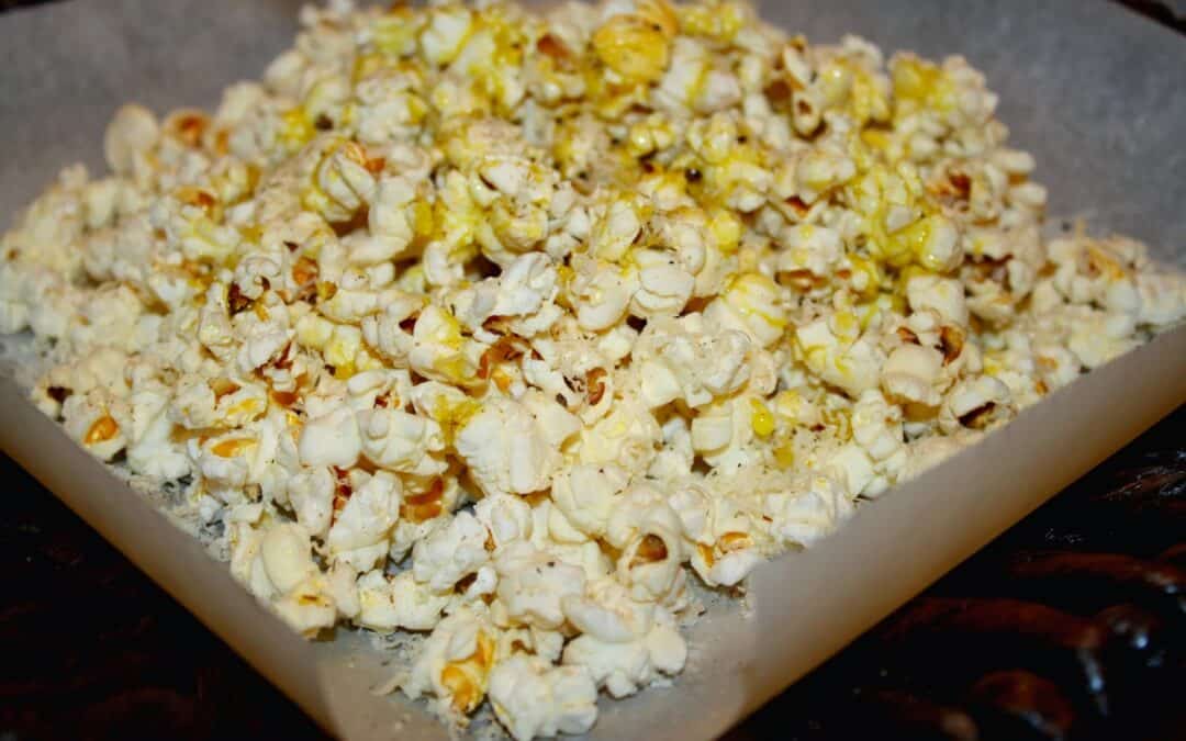 Popcorn with Grated Asiago, Cracked Black Pepper, and Wild Mushroom Sage Olive Oil